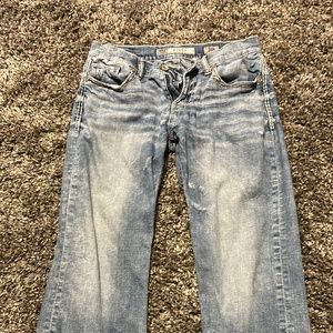 Men’s Buckle Jeans.